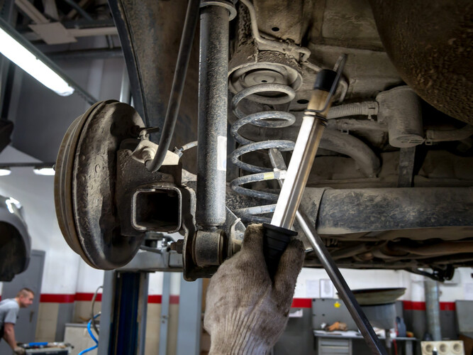 struts on the undercarriage of a car