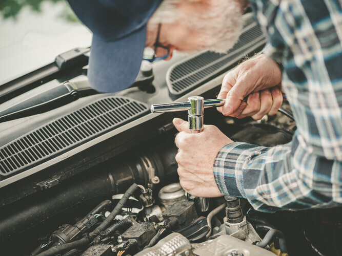 mechanic performing a tune up