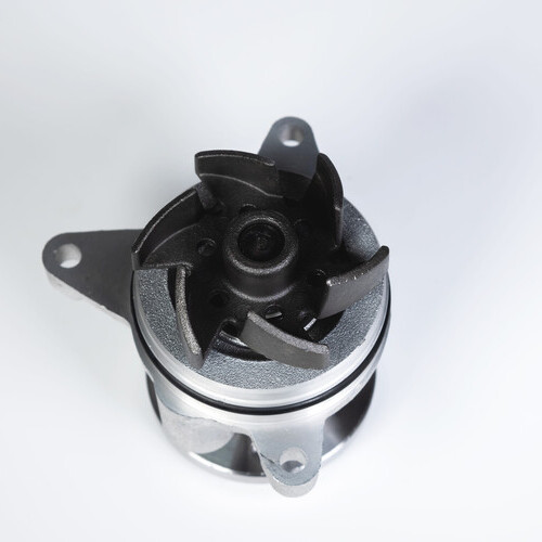 Car engine coolant water pump new on a gray background.