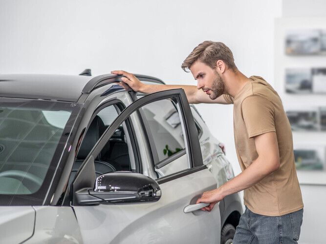 examining a car window