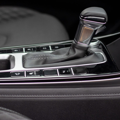 The interior of a new car. Automatic transmission in leather trim