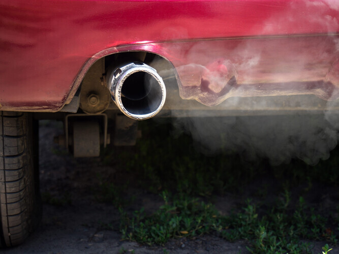 white smoke from car exhaust pipe